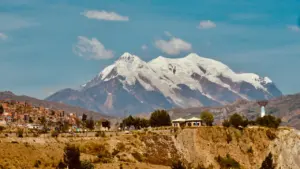 The snow-capped Illimani mountain peak towering over the landscape near La Paz, Bolivia.