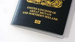 Close up of a new British passport on a clean white table.